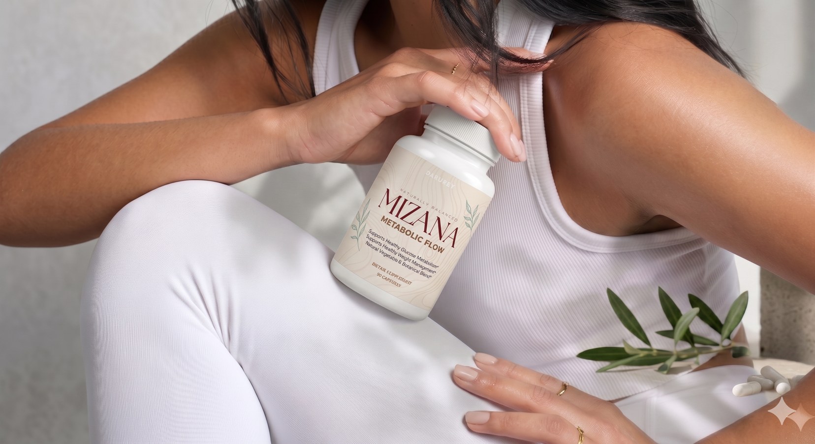 Woman holding a Mizana Metabolic Flow bottle